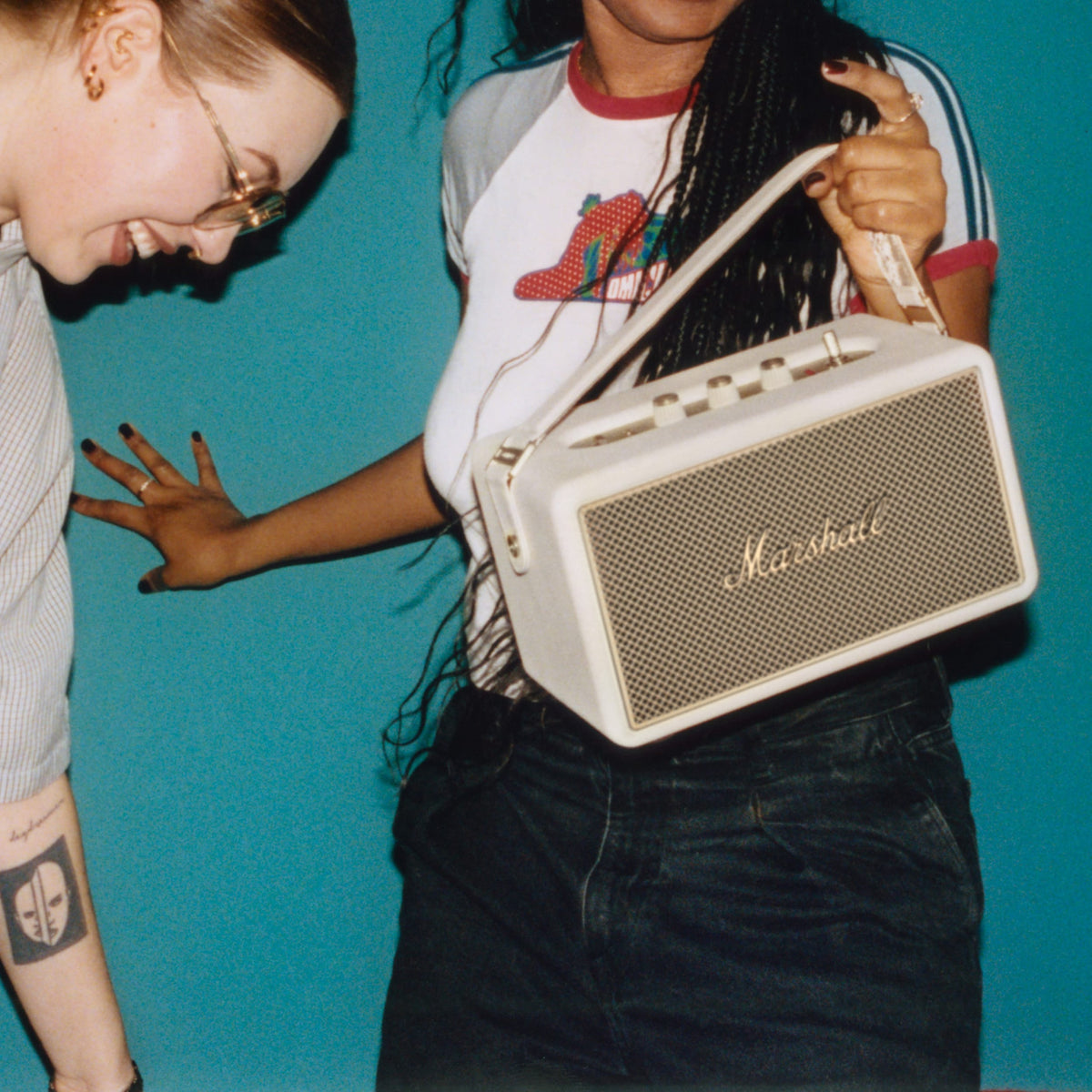Marshall – Kilburn III - Portable Speaker - Cream, white handbag carried by a woman, side view