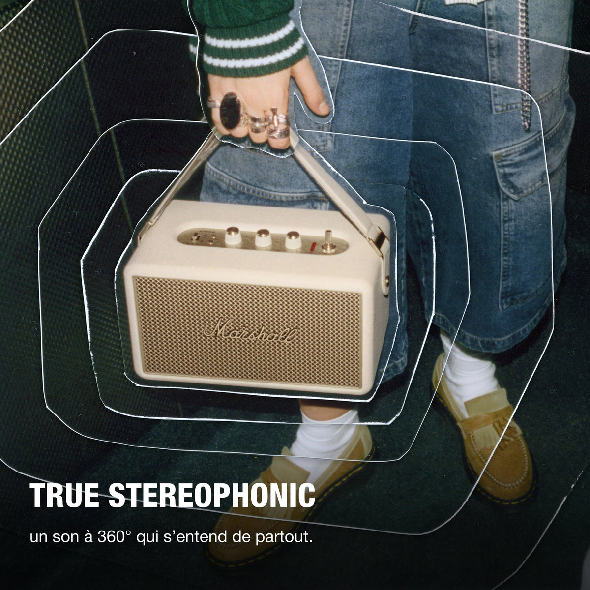 Marshall – Kilburn III - Portable Speaker - Cream, a person carrying a beige portable speaker with gold details