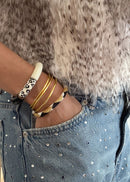 Brazalete budista fino - oro claro