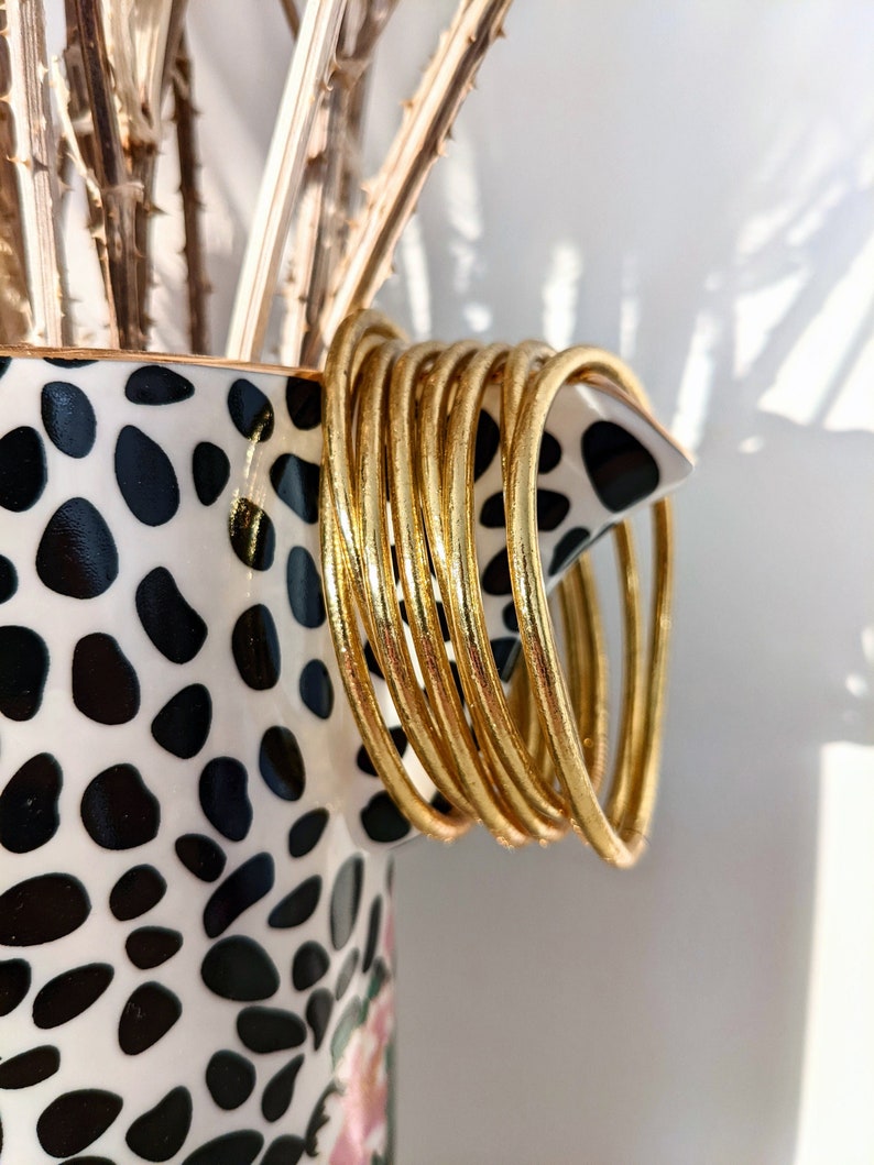 Brazalete budista fino - oro claro