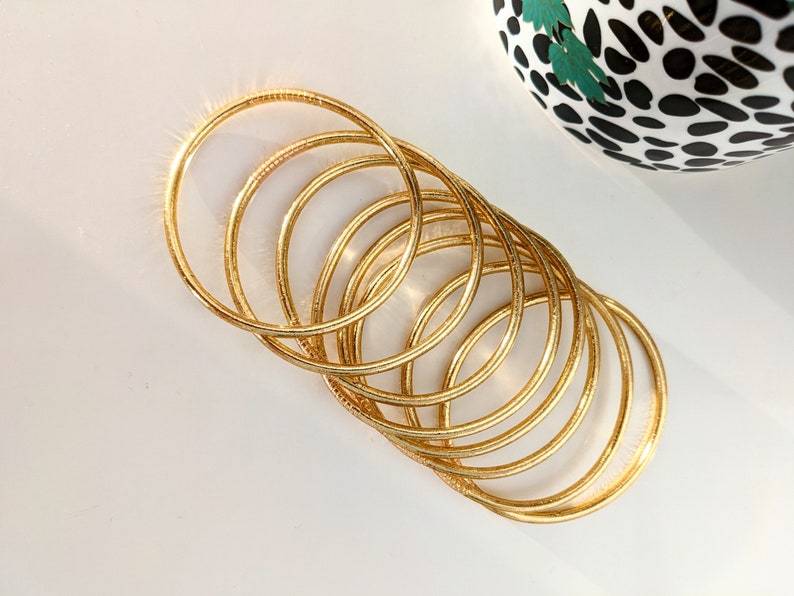 Brazalete budista fino - oro claro