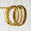 Brazalete budista trenzado - oro claro