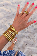 Brazalete budista trenzado - oro claro