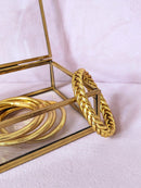 Brazalete budista trenzado - oro claro