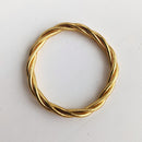 Brazalete budista retorcido - oro claro