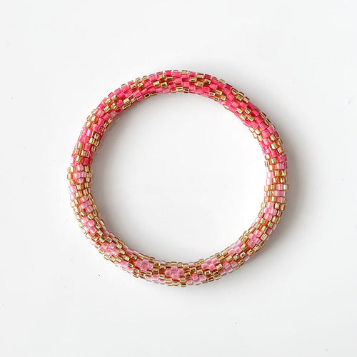 Pulsera nepalí #44 (rosa coral y oro)
