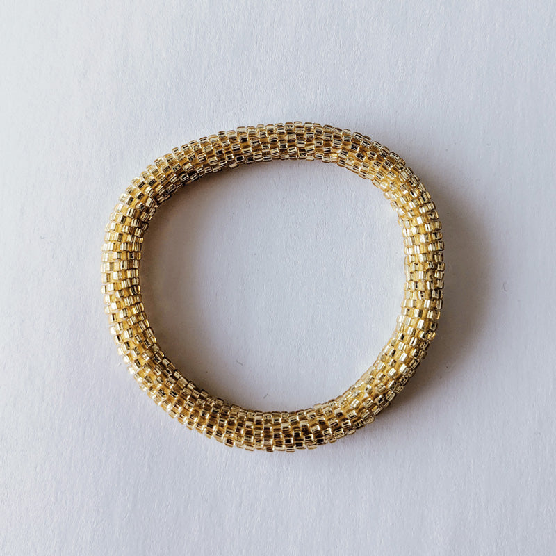 Pulsera nepalí #7 (oro claro)