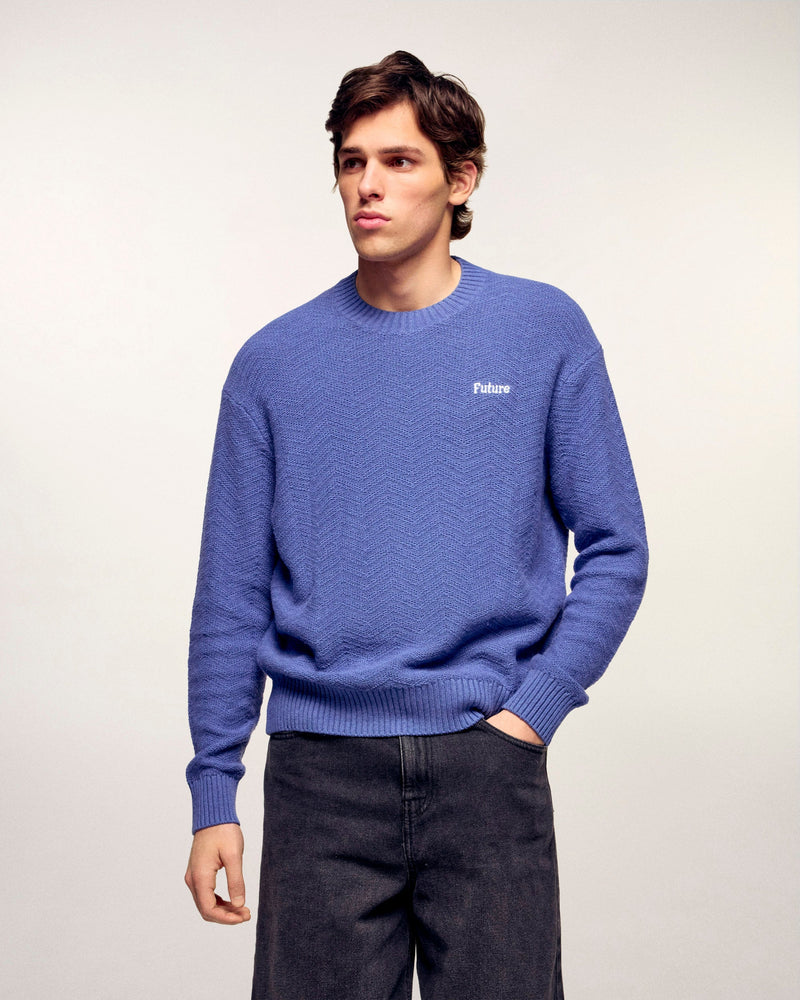 #label: Dren mesure 1,89m et porte une taille M