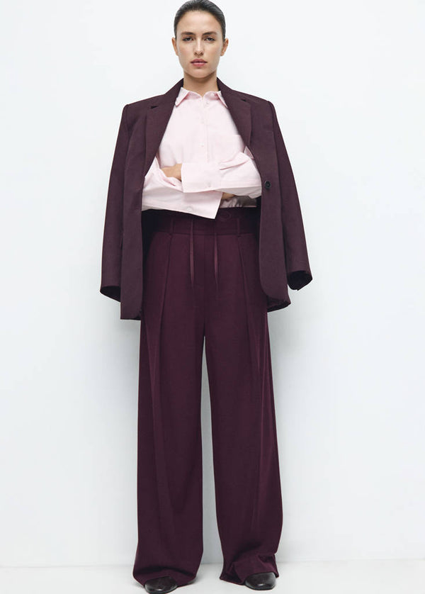 Pantaloni a pieghe combinati in vita
