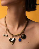 Charm - Moneda de oro