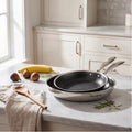 Hera - Set Di 2 Padelle Triplex Antiaderenti - 24/32 cm - Nero/Argento
