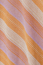 El top naranja de Janet