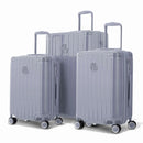 Trio de valises rigides GYL Intemporelle argent avec coques nervurées et poignées télescopiques. #couleur_argent