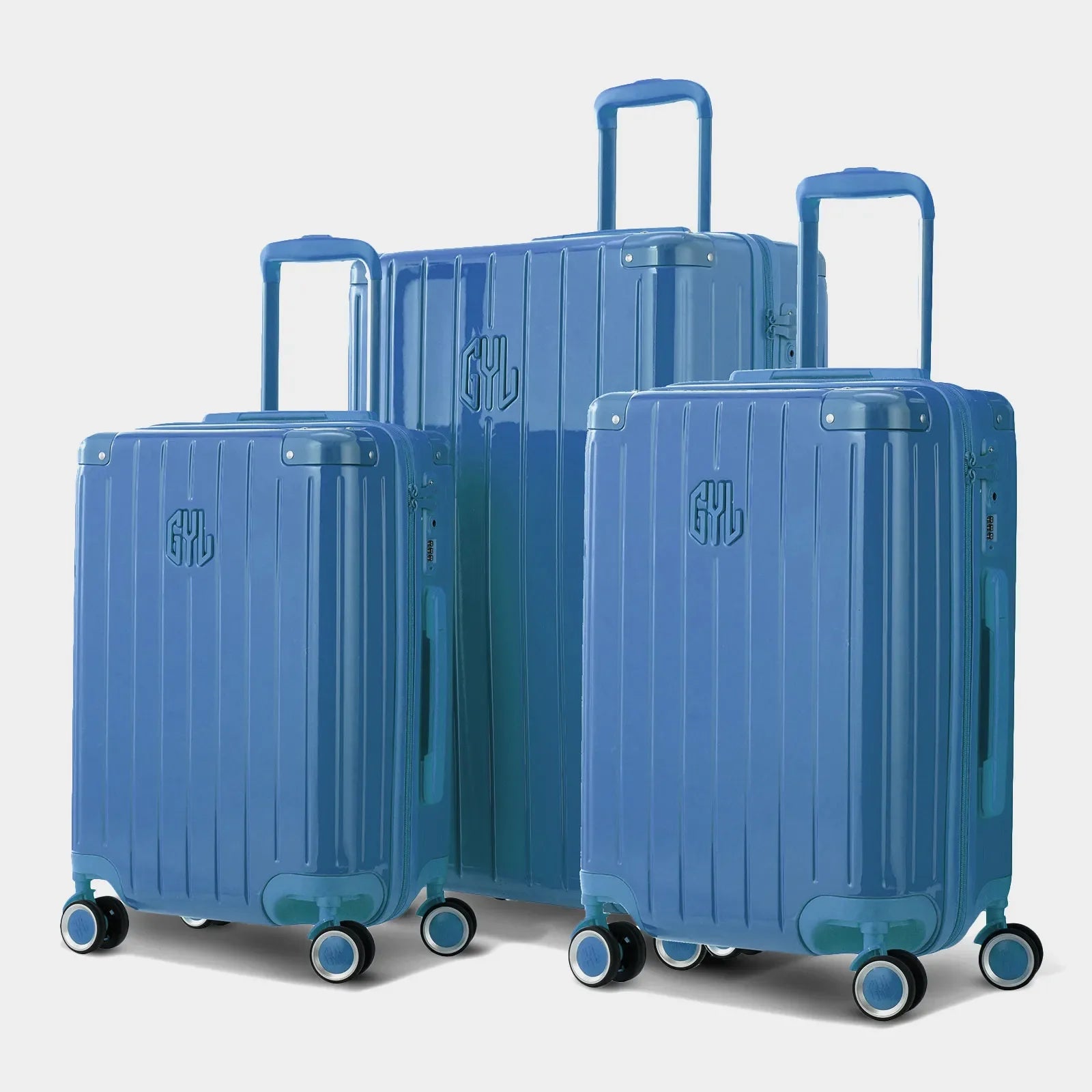 Trio de valises rigides GYL Intemporelle bleu grisé avec coques nervurées et poignées télescopiques.  #couleur_bleu grisé