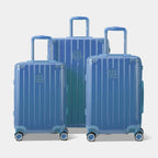 Trois valises rigides GYL Intemporelle bleu grisé, format cabine et soute, avec poignée trolley déployée.  #couleur_bleu grisé
