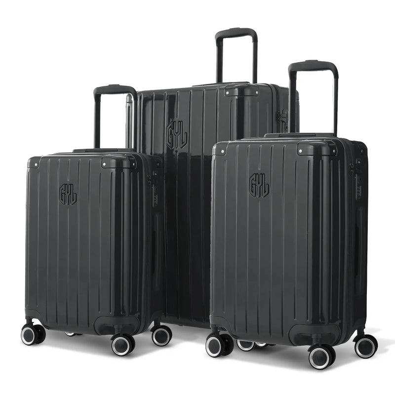 Trio de valises rigides GYL Intemporelle gris foncé avec coques nervurées et poignées télescopiques.  #couleur_gris foncé