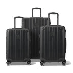 Trois valises rigides GYL Intemporelle gris foncé, format cabine et soute, avec poignée trolley déployée.  #couleur_gris foncé