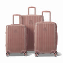 Tres maletas rígidas GYL Intemporelle color oro rosa, formato cabina y bodega, con asa tipo trolley extendida.  #color_oro rosa