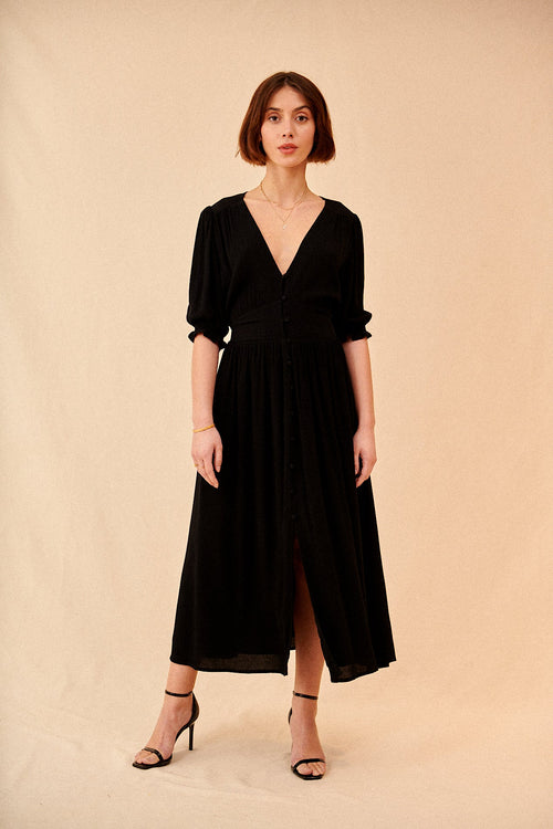 Long flowing dress with short sleeves and black buttoned V-neck madder Paris elegant spring summer