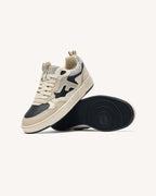 Sneaker nere e dorate in pelle