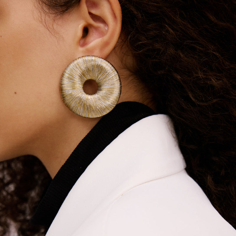 Close-up of a model wearing Boho Gold Silver Earring featuring a refined circular design and metallic threads.