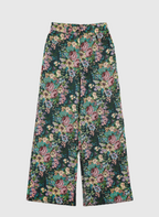 An'ge – Pantalon Passyna Noir, pantalon large à motif floral multicolore sur fond vert foncé, vue de face