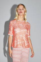 La blusa Poppy con lentejuelas naranjas