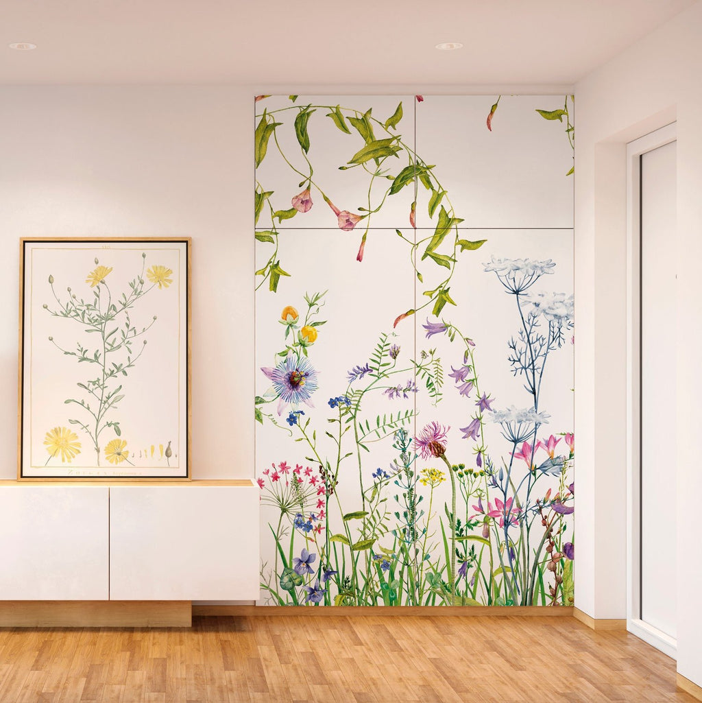 Lé Papiers De Ninon – Adhésif De Placard Volubilis - Multicolore, une armoire blanche avec des motifs floraux colorés dans un salon lumineux