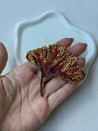 Broche vintage Xavier Loubens - Hoja dorada y pedrería roja