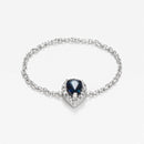 "Blue Tear" Chain Ring with 0.05/15 Diamond and 0.25 Sapphire - 375/1000 White Gold