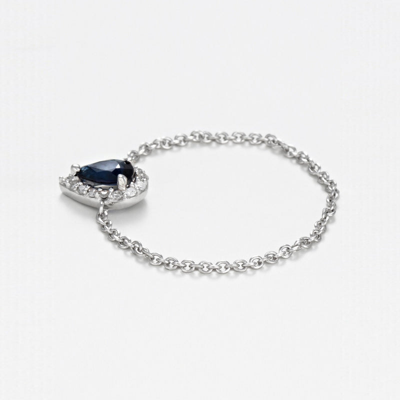 "Blue Tear" Chain Ring with 0.05/15 Diamond and 0.25 Sapphire - 375/1000 White Gold