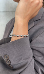 Bracciale in metallo con perla