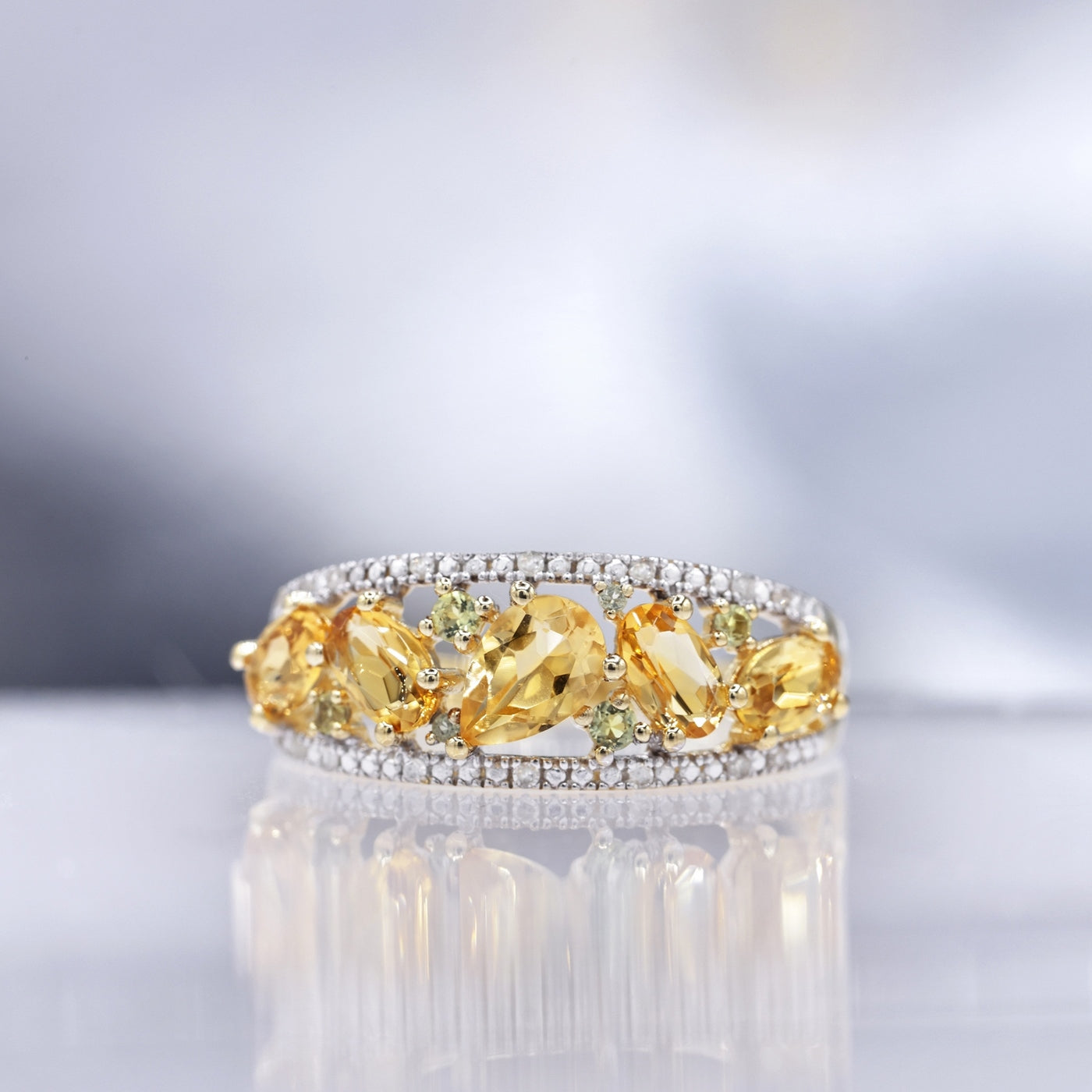 "Olivines" ring, D0.05/16 &amp; Peridot 0.14/6 &amp; Citrine 1.30/5 - 375/1000 Yellow Gold