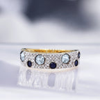 "Majunga" Ring, D 0.0035/16, Sapphire 0.1/4, Blue Topaz 0.176/3 - 375/1000 Yellow Gold