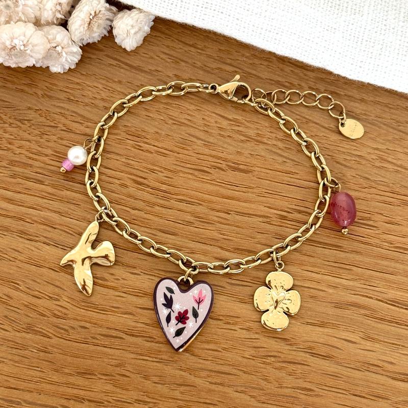 Instants Plaisirs – Bracelet "Lison" Acier, bracelet doré avec des breloques en forme de coeur, d'oiseau et de fleur