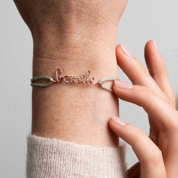 Detail of the hand shaping of the rose gold wire on cord