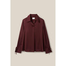 Blusa fluida con cuello abierto