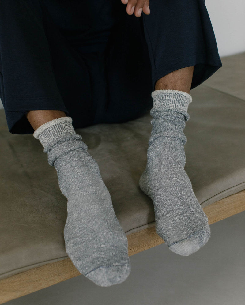 dark gray men's sock slipper Angarde worn seated