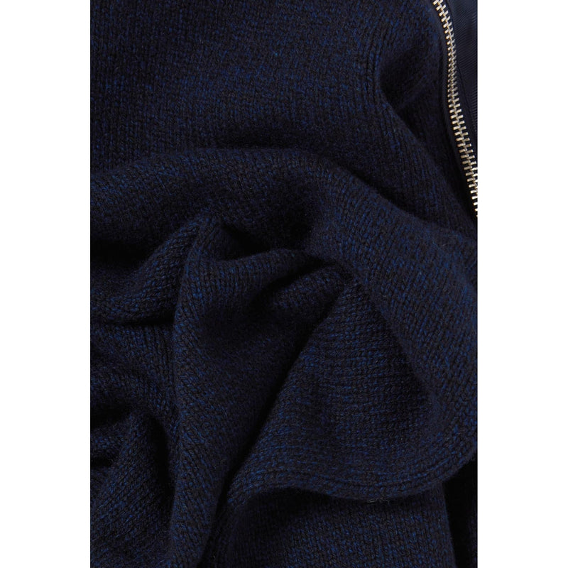 Jersey azul marino con cuello alto y cremallera