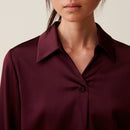 Blusa fluida con cuello abierto