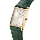 Reloj encuadernado en cuero de cocodrilo verde color champán y dorado con rayos de sol