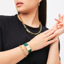 Reloj encuadernado en cuero de cocodrilo verde color champán y dorado con rayos de sol