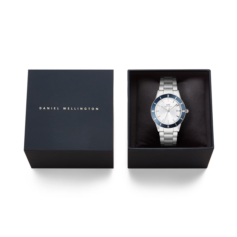Reloj icónico Paradigma Link blanco con bisel azul rayos de sol y plateado