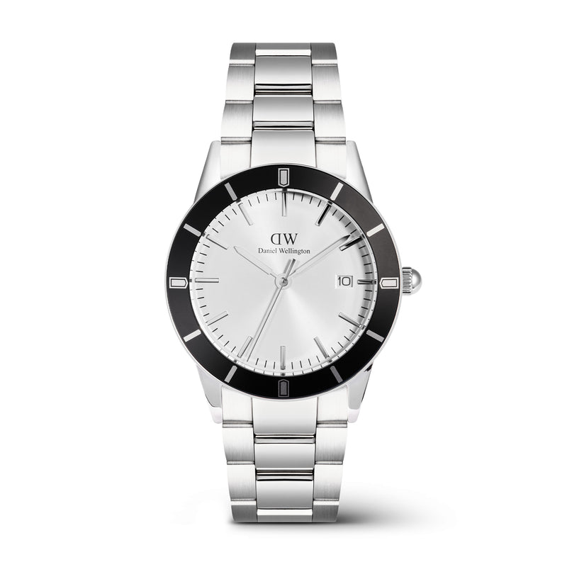Icónico reloj plateado con bisel negro y rayos de sol en blanco Paradigma Link