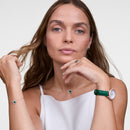 Reloj de oro rosa con bisel cristalino, cocodrilo verde, blanco y fregona