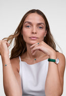 Reloj de oro rosa con bisel cristalino, cocodrilo verde, blanco y fregona