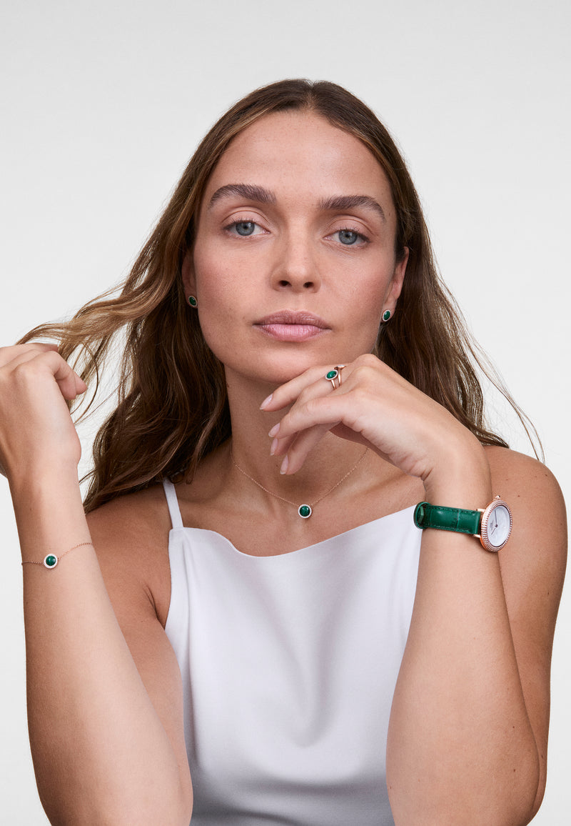 Reloj de oro rosa con bisel cristalino, cocodrilo verde, blanco y fregona