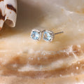 “Popi Cushion Blue Topaz” Earrings Diamond: 0.07/32 + Topaz 0.6/2 – White Gold