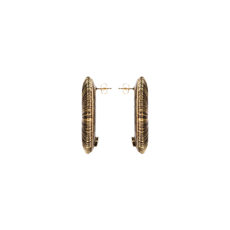 Close-up view of Boho Gold Earring showcasing intricate hand-wrapped metallic threads in circular design.