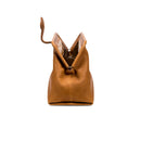 Light brown leather handbag with an open rope closure on a white background, shown from the side.